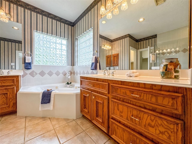 bathroom featuring tile patterned floors, vanity, and a bathtub