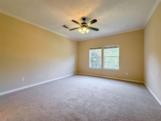 carpeted empty room with a textured ceiling, ceiling fan, and crown molding