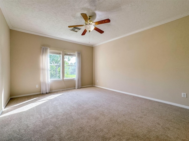 carpeted empty room featuring a textured ceiling, ceiling fan, and ornamental molding