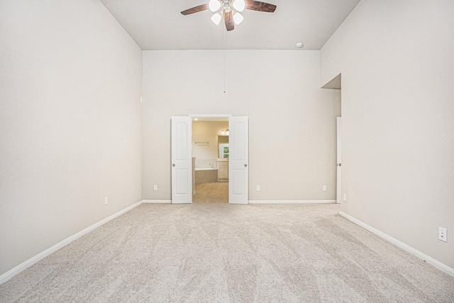 unfurnished bedroom with ceiling fan and carpet