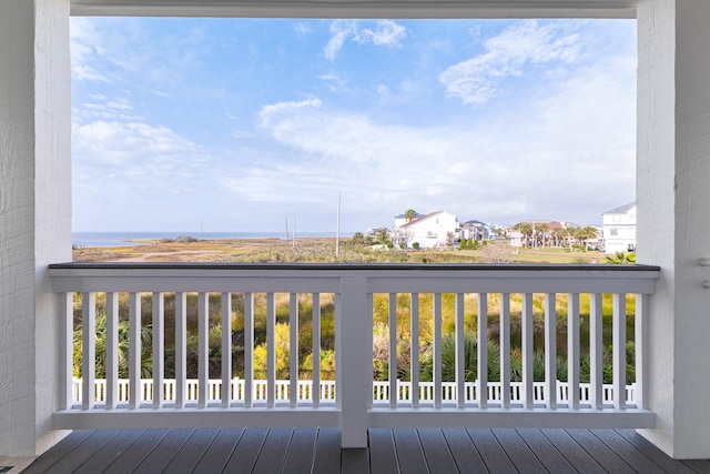 wooden terrace with a water view