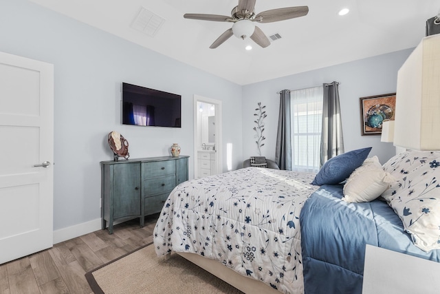 bedroom featuring connected bathroom, ceiling fan, and light hardwood / wood-style floors