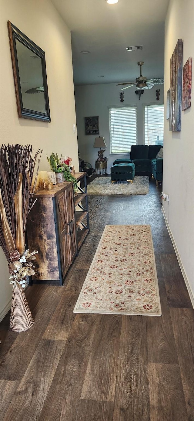 hall with dark hardwood / wood-style floors