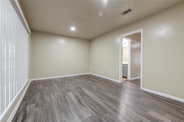 empty room featuring dark hardwood / wood-style floors