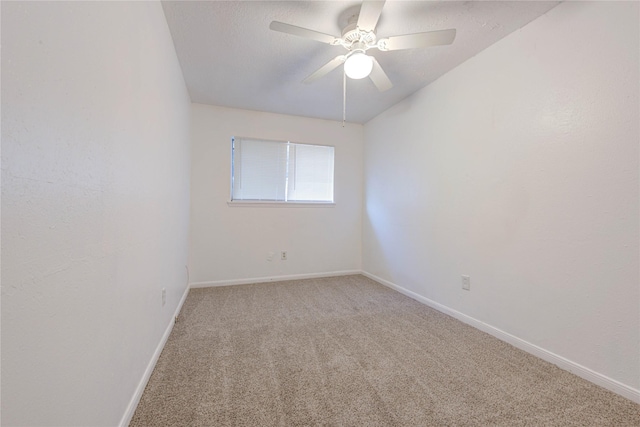 unfurnished room featuring ceiling fan and carpet floors