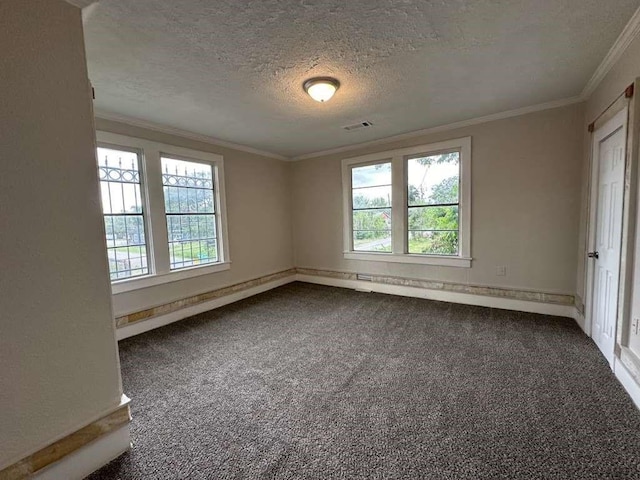 carpeted empty room with a textured ceiling and ornamental molding