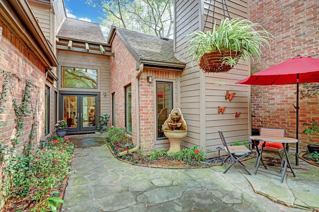 doorway to property featuring a patio area and french doors