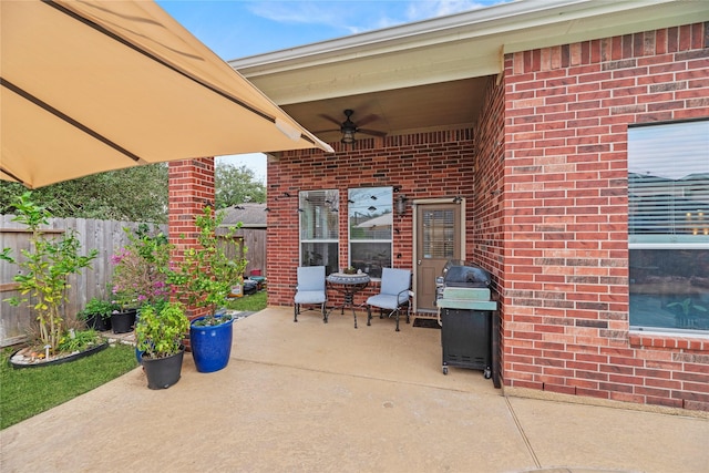 view of patio featuring ceiling fan and a grill