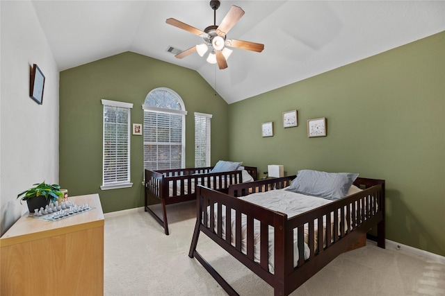 carpeted bedroom featuring ceiling fan and lofted ceiling