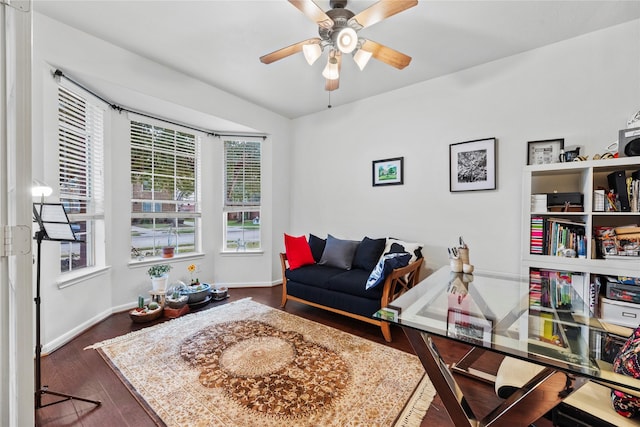 living area with dark hardwood / wood-style floors and ceiling fan