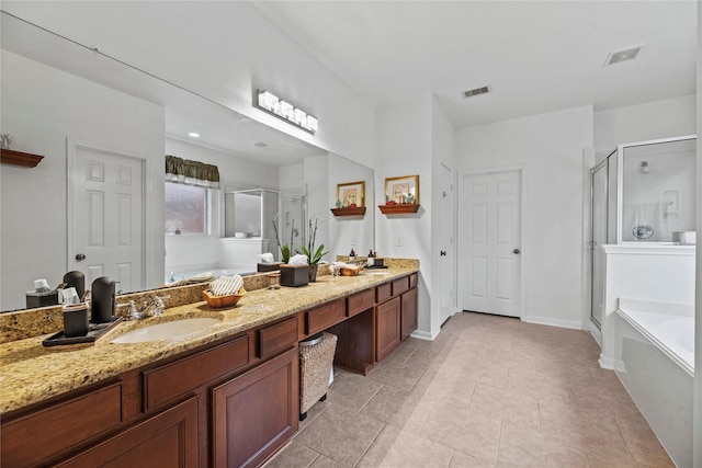 bathroom with tile patterned floors, vanity, and independent shower and bath