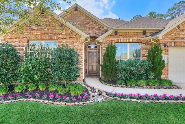 view of front property with a front yard and a garage