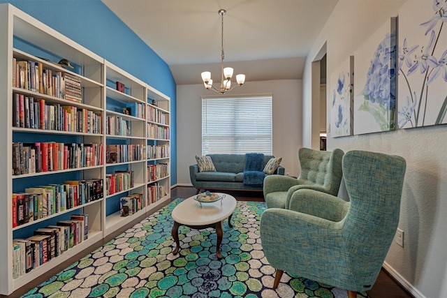 living area with lofted ceiling and a chandelier