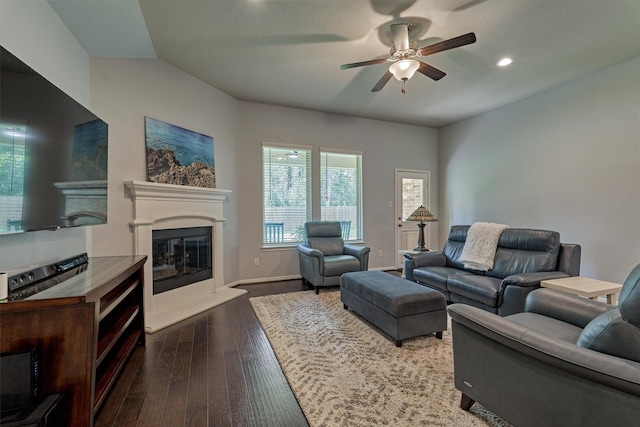 living room featuring dark hardwood / wood-style floors and ceiling fan