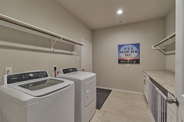 laundry room featuring separate washer and dryer