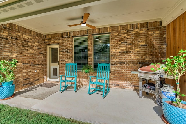 view of patio with grilling area and ceiling fan