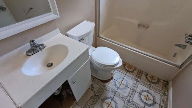 full bathroom with vanity, combined bath / shower with glass door, and toilet