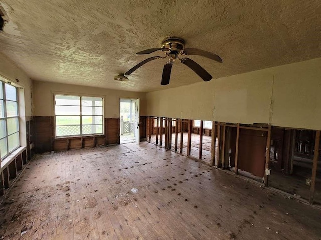 miscellaneous room featuring ceiling fan and hardwood / wood-style flooring