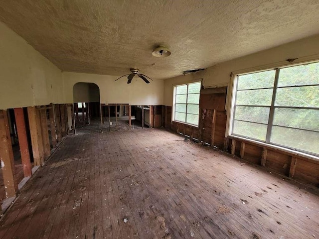 miscellaneous room with a textured ceiling, dark hardwood / wood-style floors, and ceiling fan