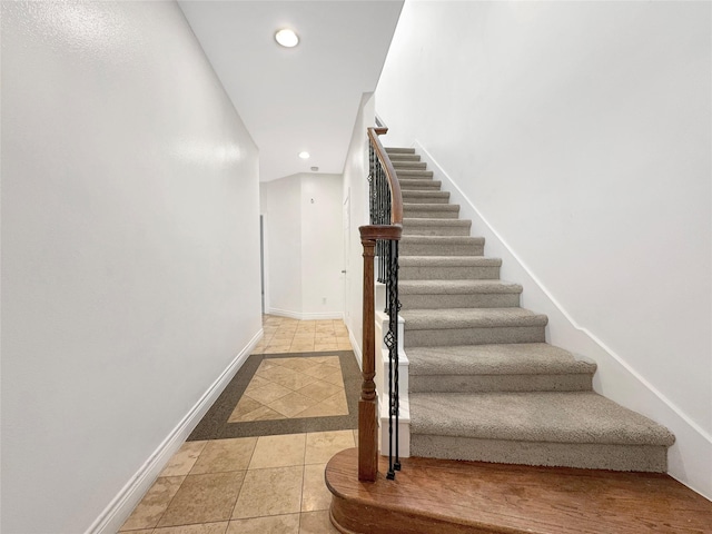 staircase with tile patterned flooring