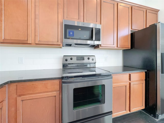 kitchen featuring backsplash and appliances with stainless steel finishes