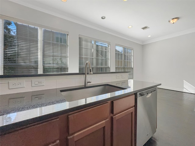 kitchen with dark stone counters, crown molding, sink, and stainless steel dishwasher