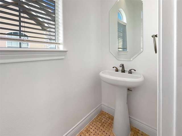 bathroom featuring tile patterned flooring and sink