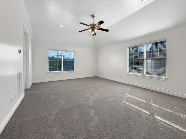 unfurnished room with carpet floors, vaulted ceiling, ceiling fan, and ornamental molding