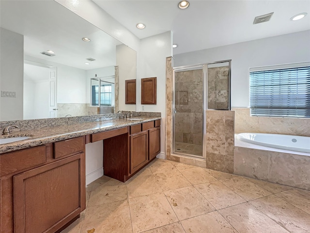 bathroom featuring tile patterned flooring, vanity, and independent shower and bath