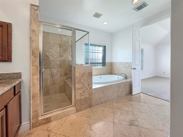 bathroom featuring plus walk in shower and vanity