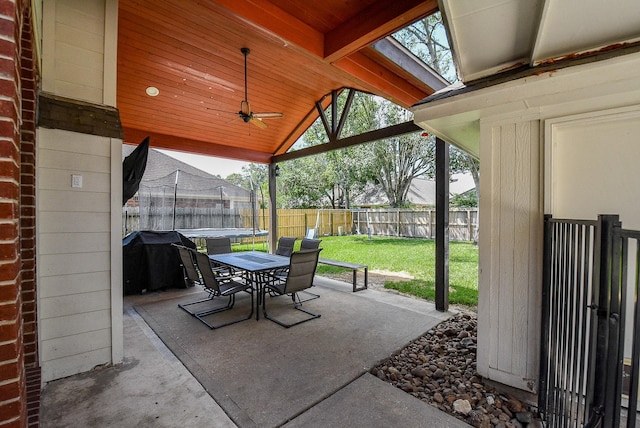 view of patio with ceiling fan and a grill