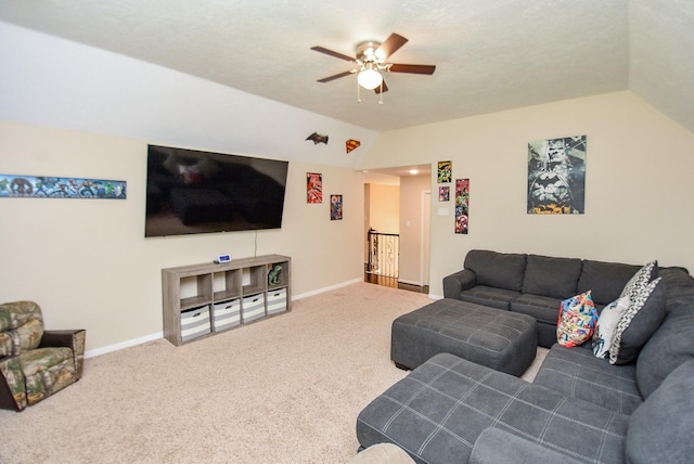 living room featuring carpet floors, ceiling fan, and lofted ceiling