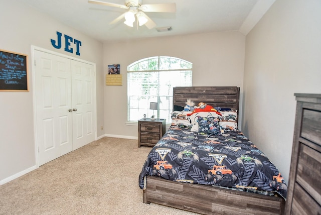 bedroom featuring ceiling fan, carpet floors, and a closet