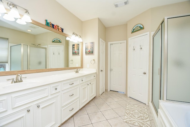 bathroom with vanity, tile patterned floors, and walk in shower