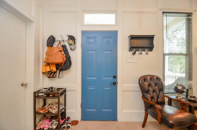 entrance foyer featuring carpet floors