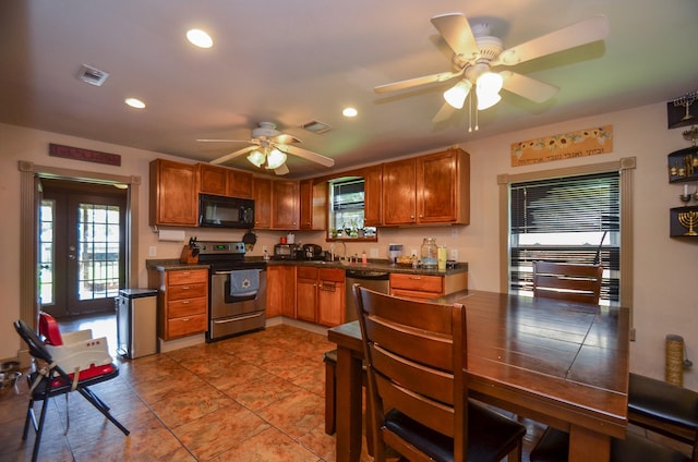 kitchen featuring ceiling fan, sink, light tile patterned flooring, and stainless steel appliances