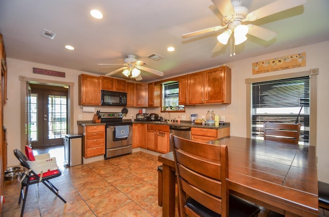 kitchen featuring light tile patterned floors, stainless steel appliances, ceiling fan, and sink