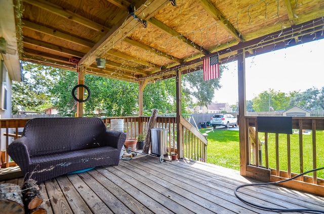 wooden terrace featuring a yard