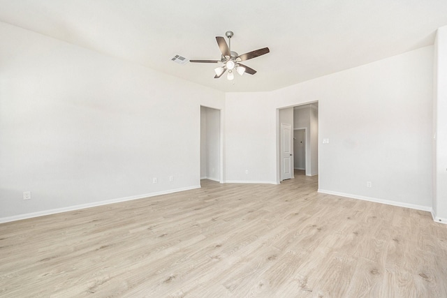 spare room with ceiling fan and light wood-type flooring