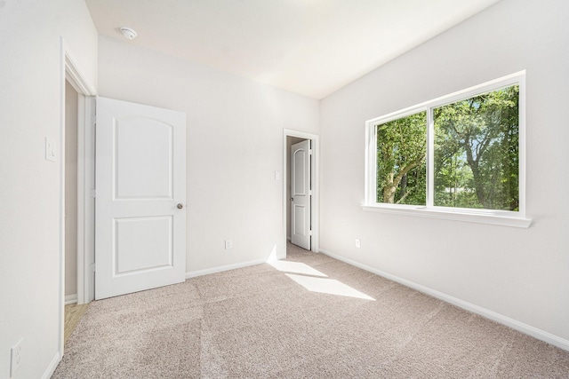 unfurnished bedroom with light carpet