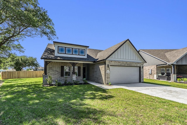 view of front of house featuring a front yard and a garage