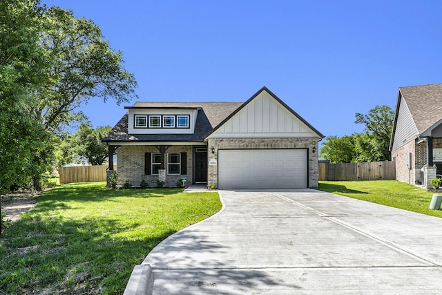 view of front facade featuring a front lawn and a garage