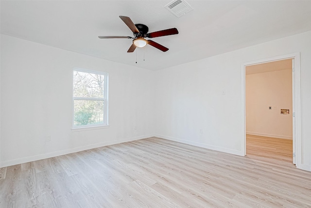 spare room with light hardwood / wood-style flooring and ceiling fan