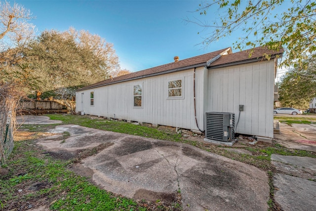 back of property featuring a patio and central air condition unit