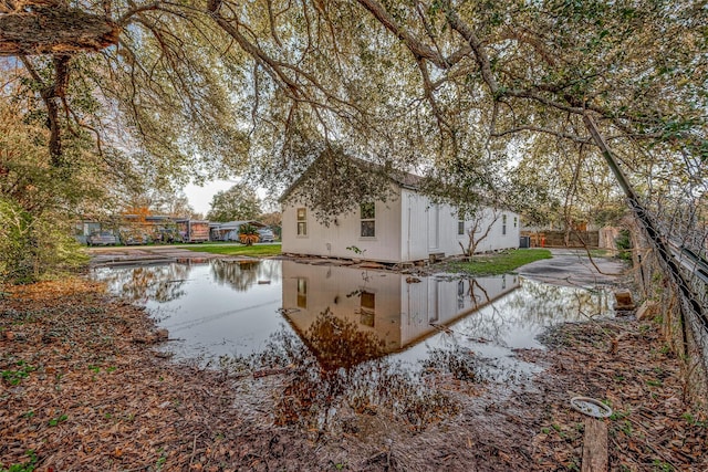 view of property exterior featuring a water view