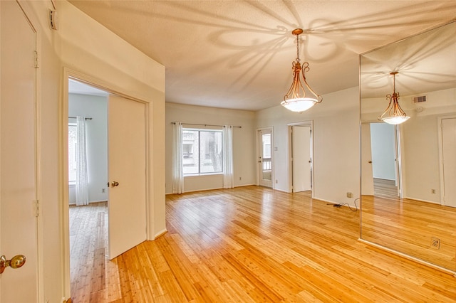 spare room with hardwood / wood-style flooring