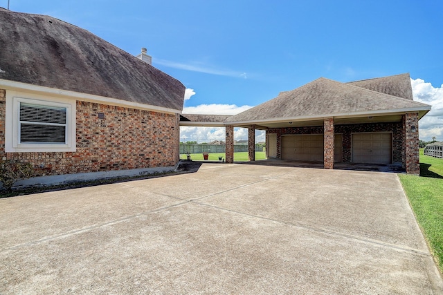 view of side of home with a garage