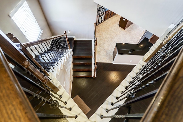 stairs featuring tile patterned flooring