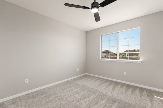 unfurnished room with carpet flooring and ceiling fan