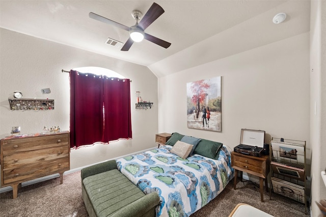 carpeted bedroom with ceiling fan and lofted ceiling